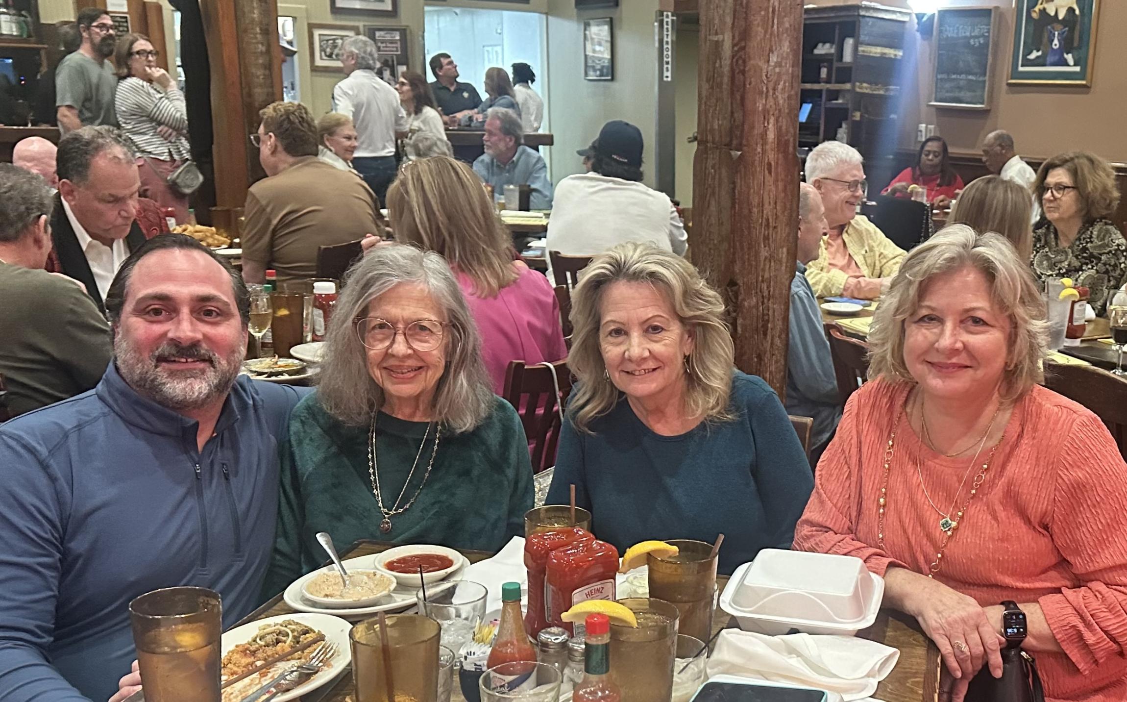 Webb eating dinner with his mom and two of his sisters